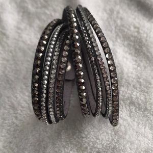 Gray suede wrap bracelet with rhinestones.